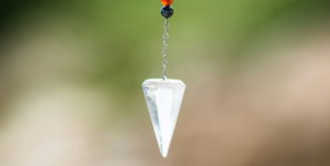silver diamond pendant with red blue and yellow beads