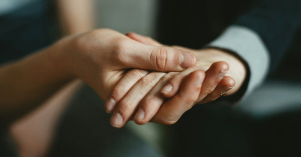 person-holding-babys-hand.jpg person holding babys hand
