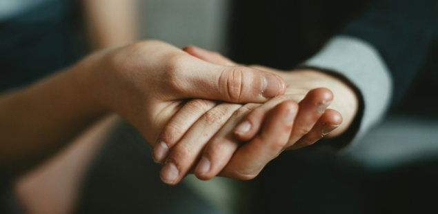 person-holding-babys-hand.jpg person holding babys hand